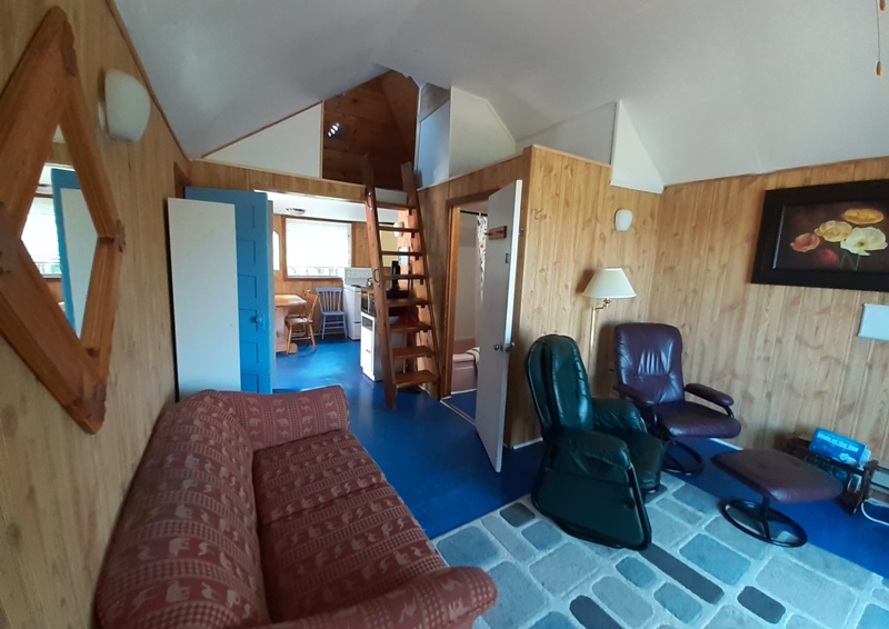 Cottage #3 living room towards kitchen, with loft above